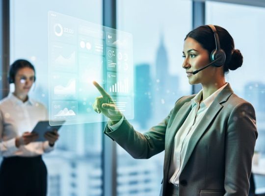 Marketing professional in a modern office pointing toward a glowing, textless dashboard display representing paid search performance and fast ROI.