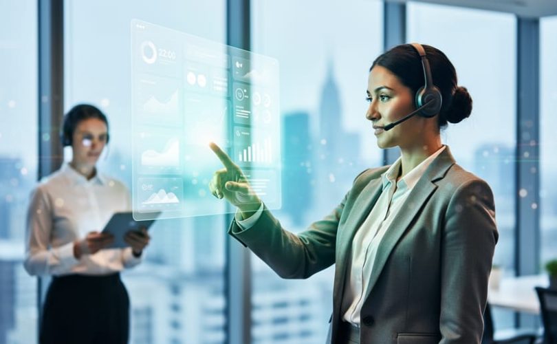Marketing professional in a modern office pointing toward a glowing, textless dashboard display representing paid search performance and fast ROI.